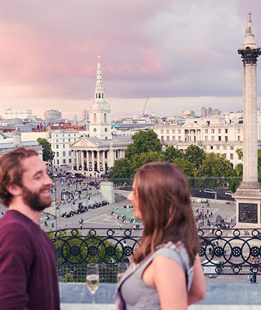 Couple enjoying champaign on London Rooftop